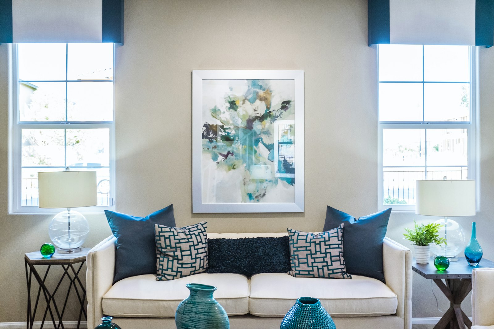 A serene minimalist living room in warm neutrals with sculptural furniture
