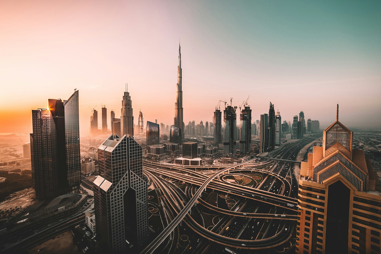 Dubai's towers rising through golden evening haze